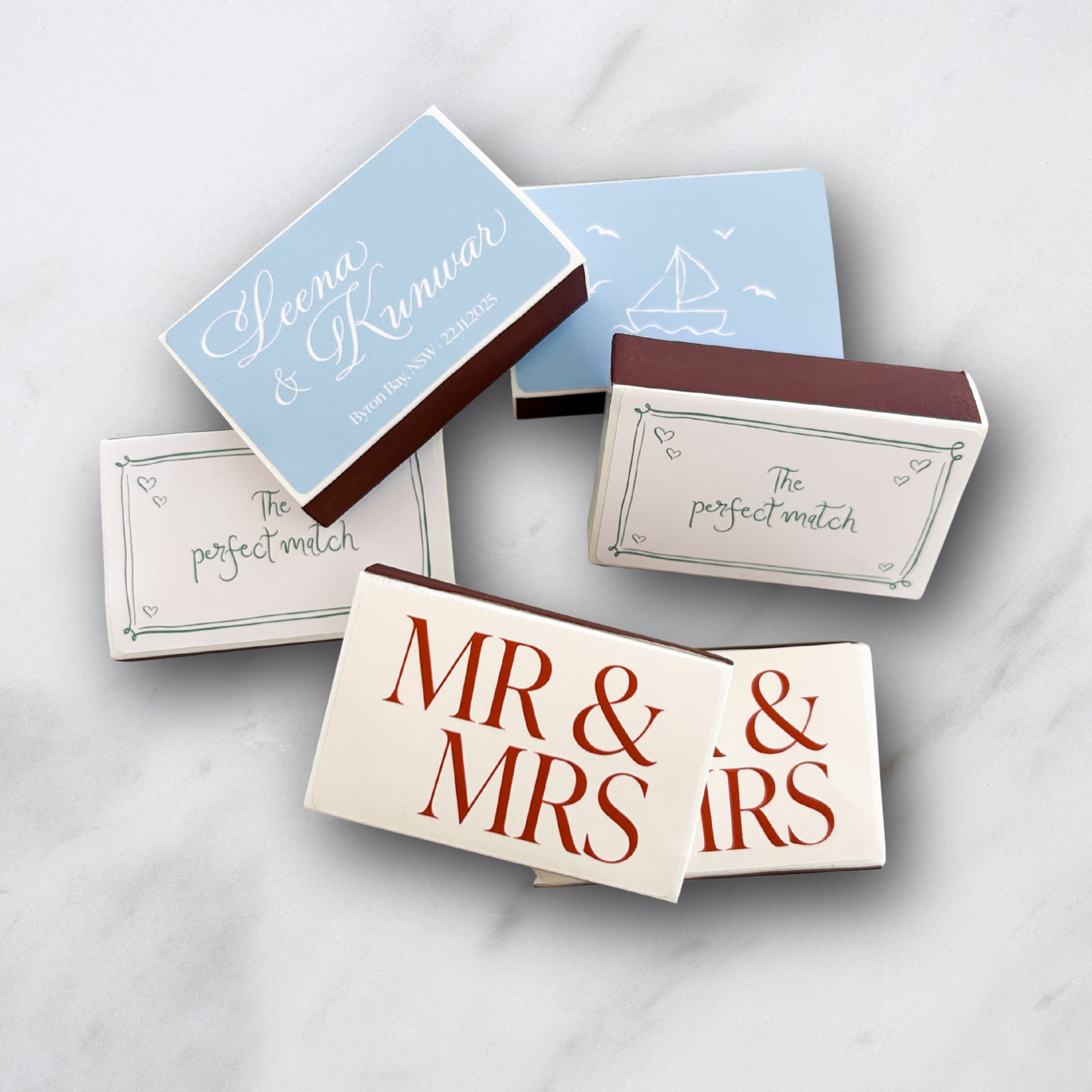 Matchboxes with 'Mr & Mrs' and personalized text on a light background